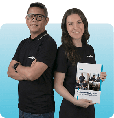 LevelUp team members holding The 8-Step Onboarding System guide for offshore employee retention.