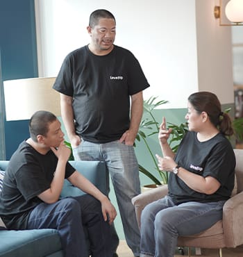 Customer Support Professionals discussing in a modern office, collaborating during the recruitment process