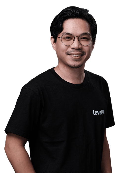 A smiling professional wearing a LevelUp t-shirt, representing the expertise of offshore IT and software development teams