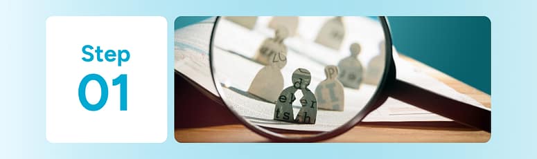 A magnifying glass zooming in on figures to illustrate the importance of defining job roles and outcomes before hiring offshore talent