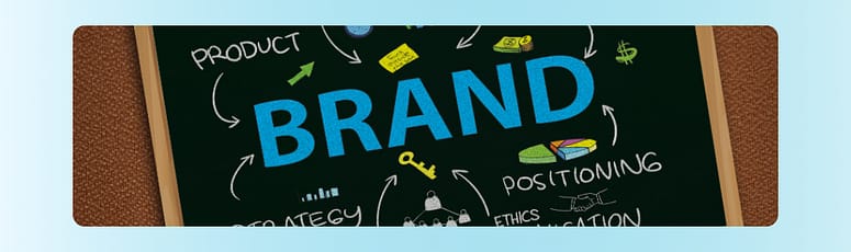 Visualizing Brand Identity A graphic designer in the Philippines working at a desk with a computer, creating a colorful logo design.