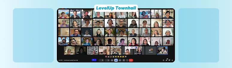Screenshot of a large virtual meeting with LevelUp team members visible in individual video tiles during an online town hall session.