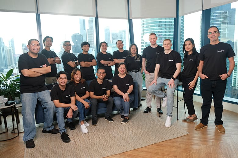 The LevelUp Team posing professionally in their office space.
