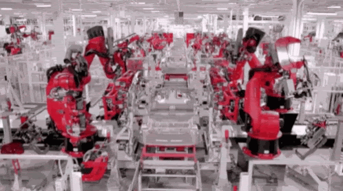 Robotic arms working on an automated production line inside a factory