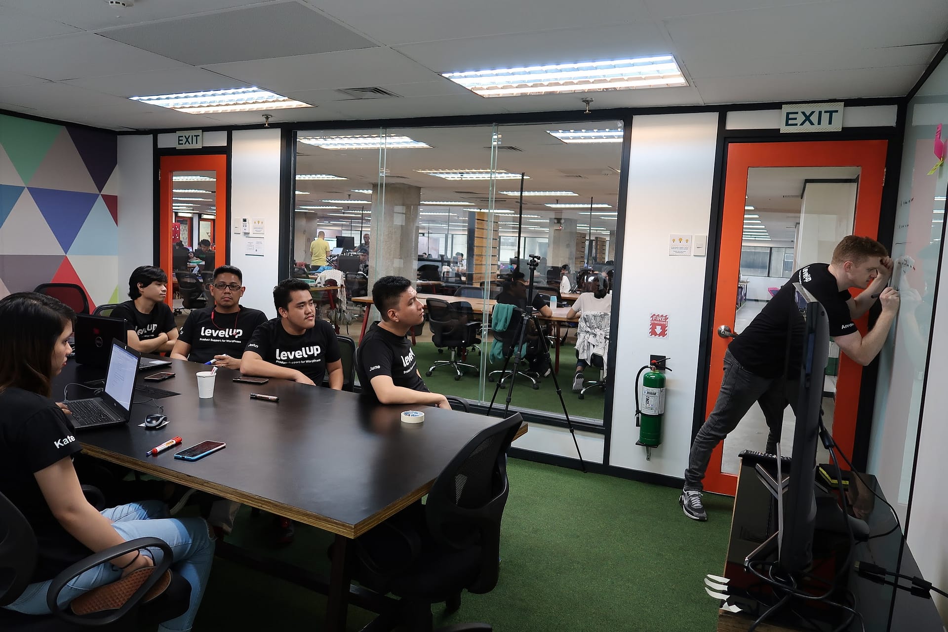 LevelUp team members seated in a meeting room during a feedback discussion