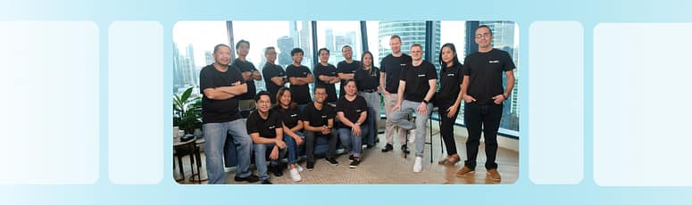 The LevelUp Team Scaling Together with EOS LevelUp team in matching black shirts, showcasing unity and growth after successfully implementing EOS.