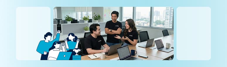 Remote and offshore marketing team collaborating in a shared office space, discussing ongoing marketing work.