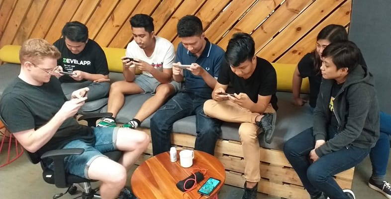 LevelUp team members sitting together on a couch