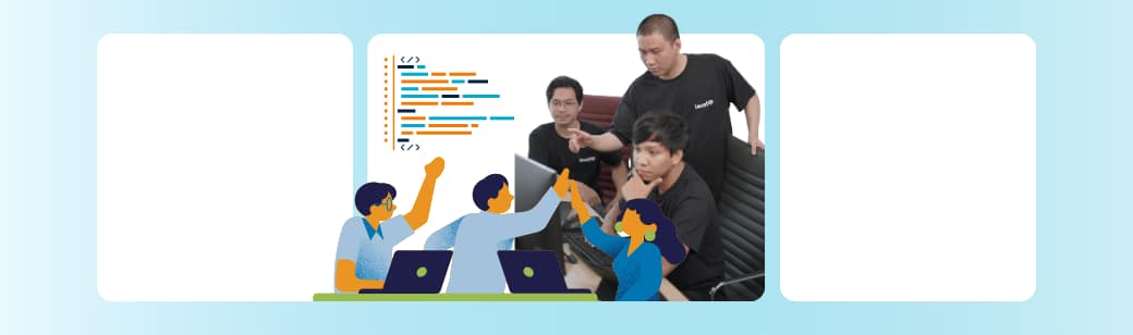 A group of software developers collaborates around computers, reviewing code together.